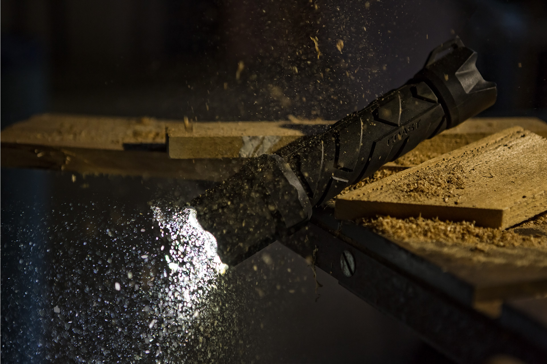 Brand Photography for Coast Products showing Polysteel flashlight falling on a pile of wood
