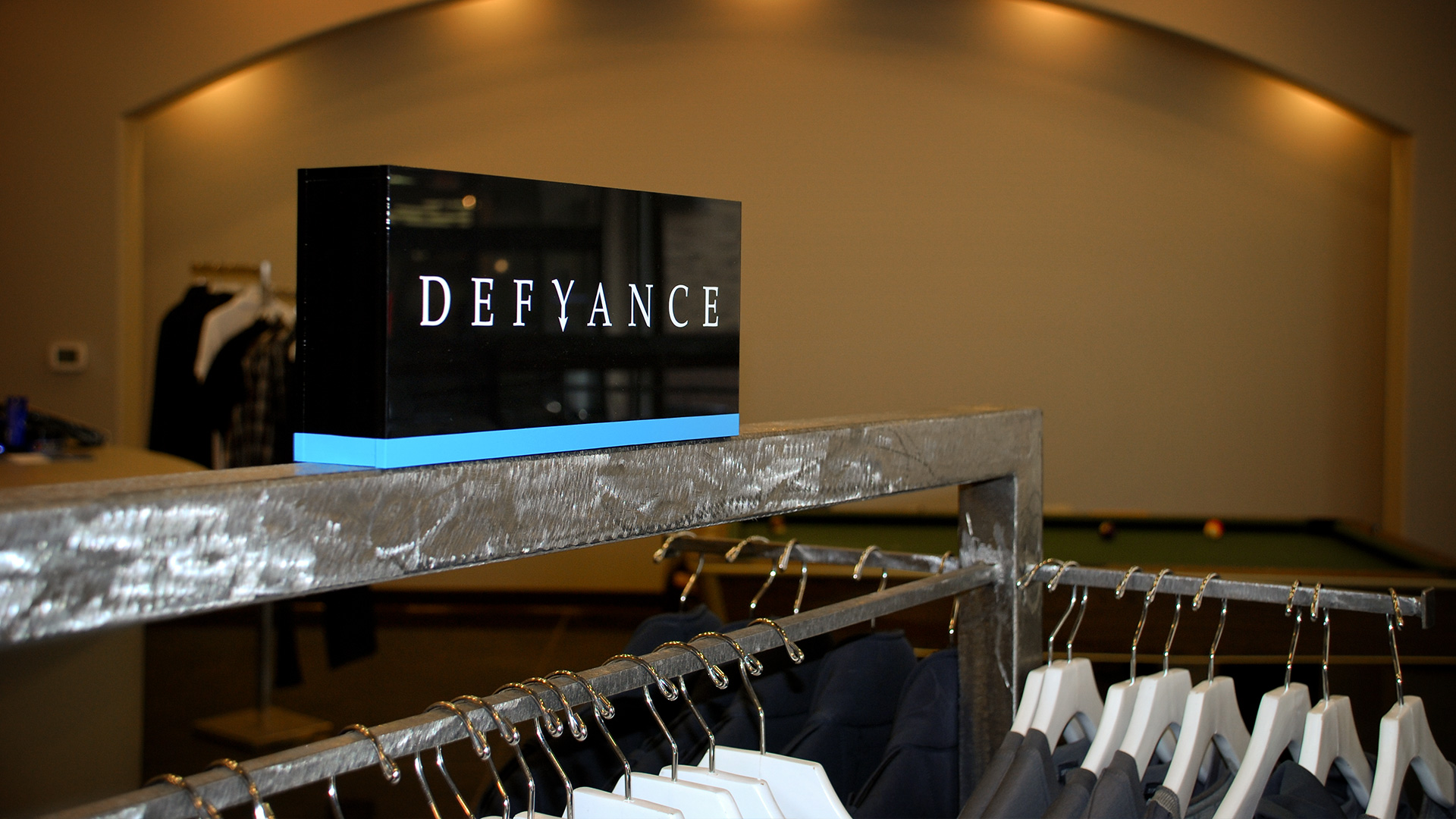 Defyance logo on signage in retail space