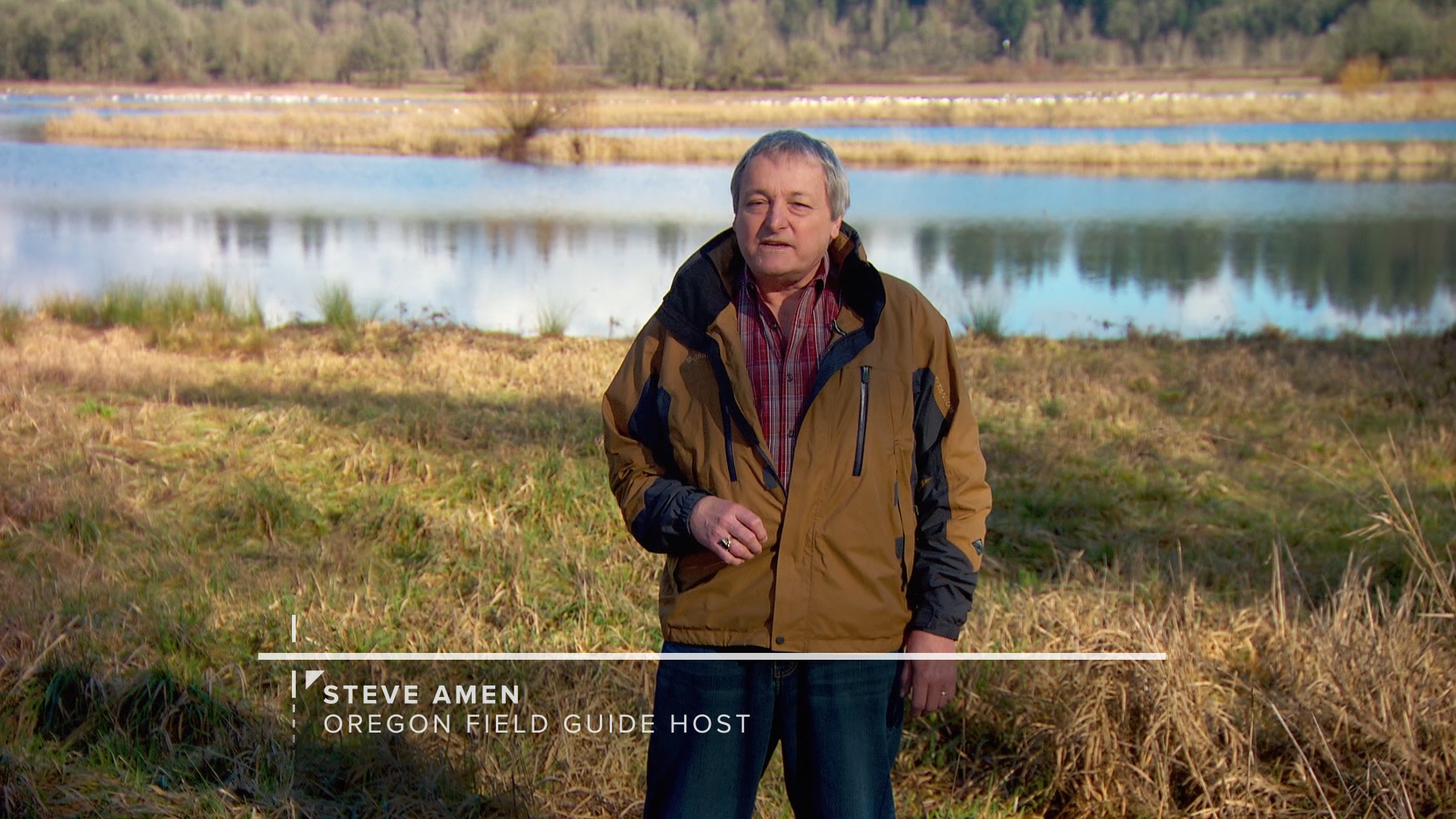Lower third graphics for Oregon Field Guide overlaid on footage of Steve Amen standing near wetlands
