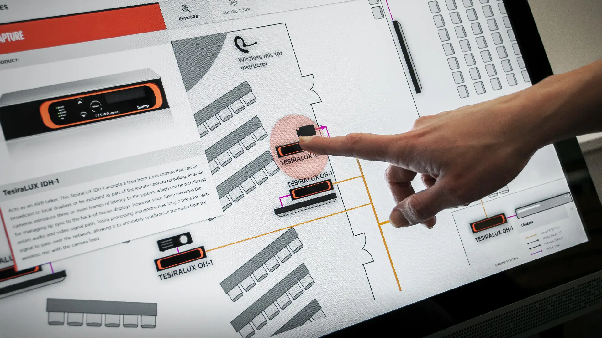 Person using Biamp's System Design Guide Touchscreen Application