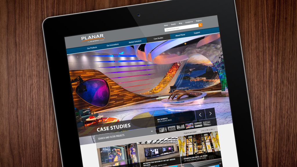Planar Case Studies website shown on mobile device on table