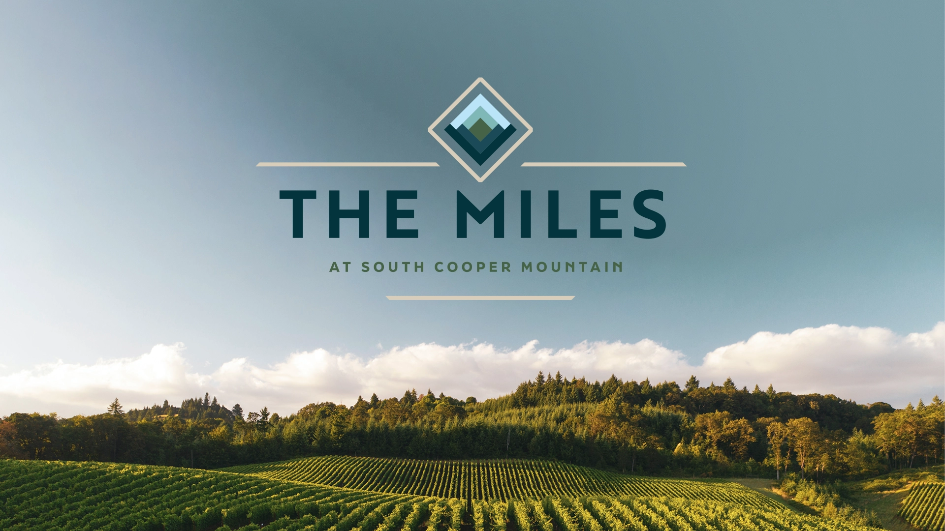 The Miles at South Cooper Mountain brand Logo over an image of fields created by Incubate Design