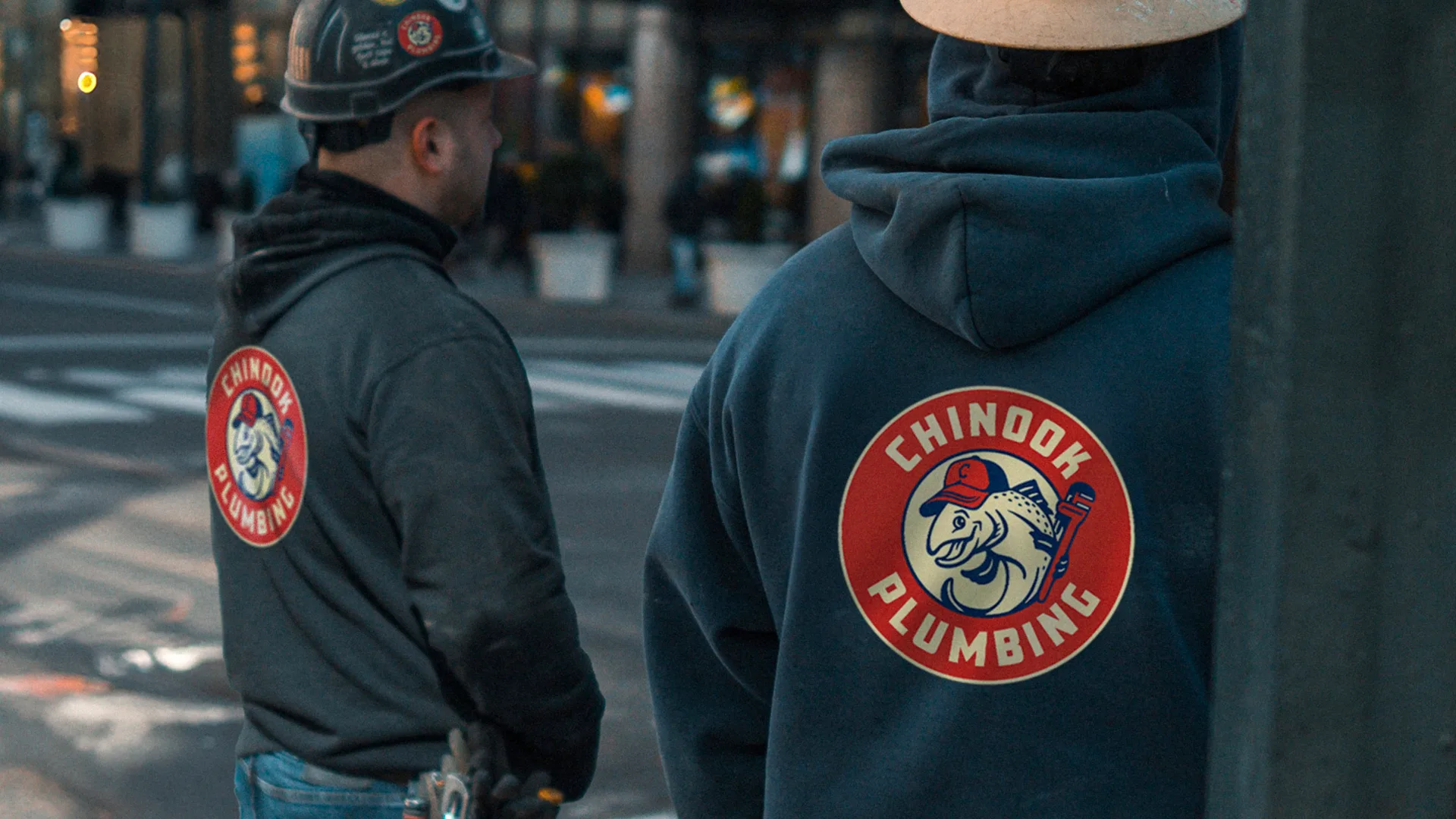 Chinook Plumbing plumbers wearing new branded hoodies and helmets with chinook plumbing logos