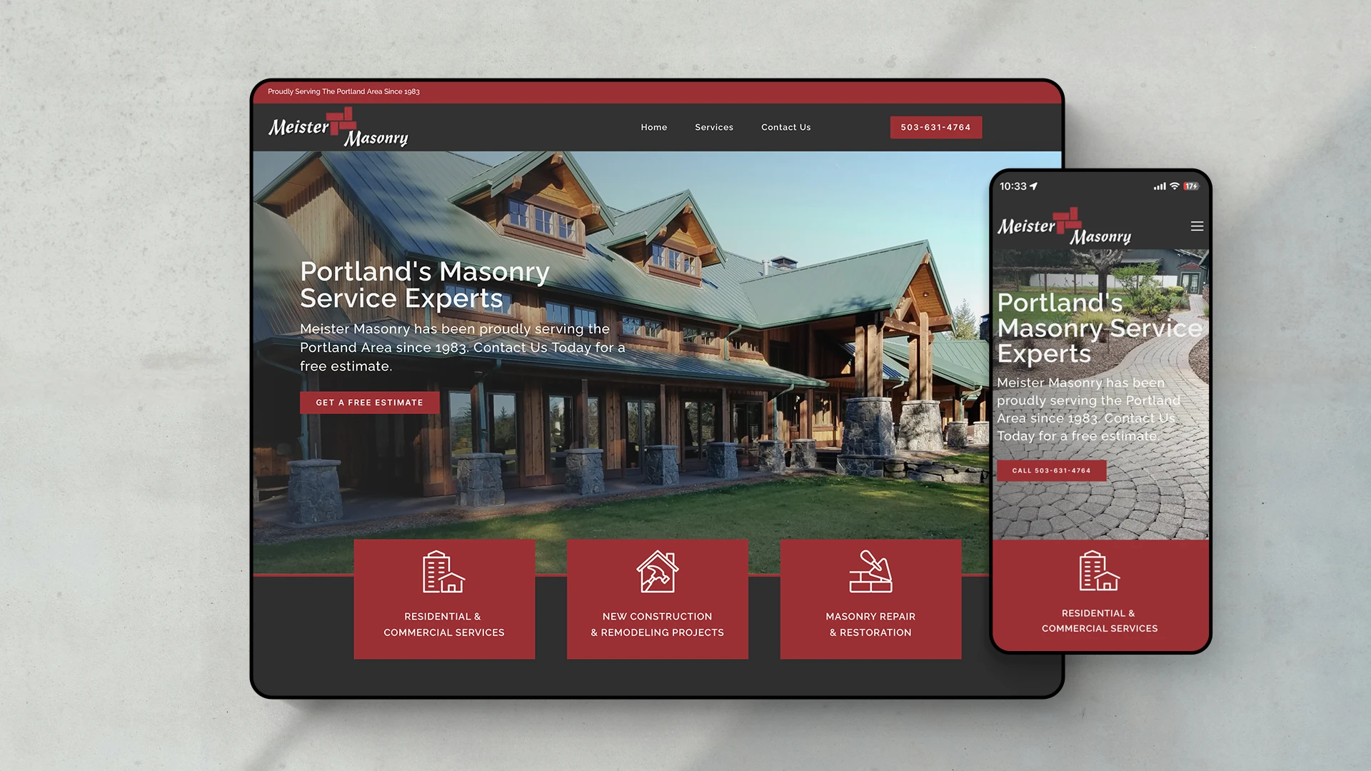 Meister Masonry homepage web design shown on mobile devices sitting on stone pavers