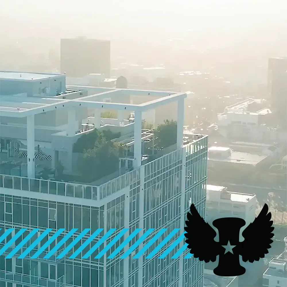 Apartment tower in LA with Incubate logo and brand stripes